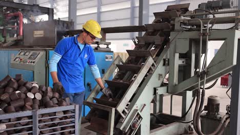 Men-are-pouring-raw-material-into-large-forging-plant,-Industrial-safety-first-concept