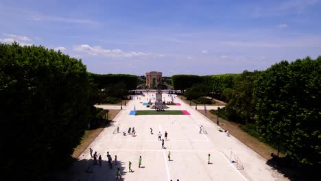 Aerial-dolly-shot-school-kids-playing-on-courts-made-in-downtown-Montpellier