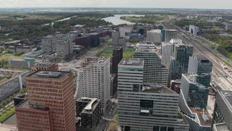 Amsterdam-Zuidas-Business-District-In-Amsterdam,-The-Netherlands---Aerial-Drone-Shot