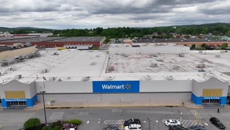 Walmart-shopping-market-with-parking-cars-in-American-town