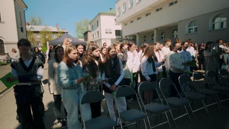 High-school-teenage-pupils-lined-up-in-audience-during-graduation-event