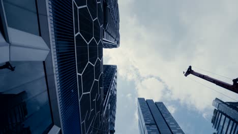 Abstract-time-lapse-looking-up-driving-through-the-business-district-in-Singapore