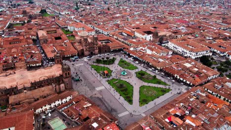 aerial-drone-shot-of-Cusco,-travelling-in-plaza