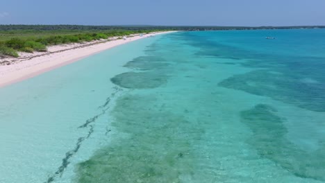 Aerial-forward-panorama-exotic-white-sand-beach-paradise-in-the-Caribbean