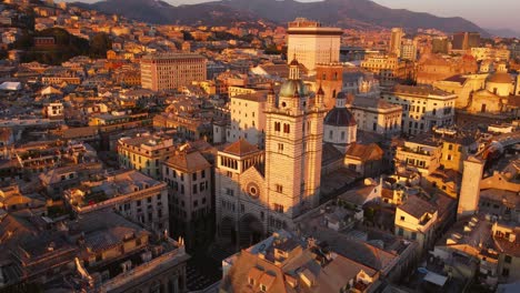 Genoa's-historical-center-at-sunset,-highlighting-its-iconic-architecture,-aerial-view