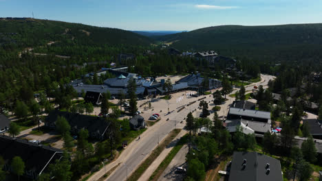 Aerial-view-circling-the-Holiday-club-spa-hotel,-summer-in-Saariselka,-Finland