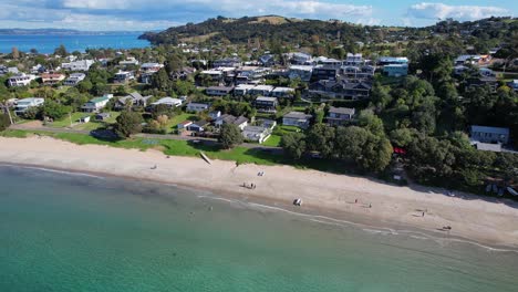 Sandy-Shore-Of-Big-Oneroa-Beach-In-Auckland,-New-Zealand---Aerial-Shot