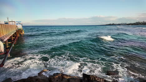 Calm-sea-view-with-a-pier-extending-into-the-water