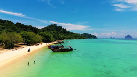 4K-Cinematic-nature-drone-footage-of-a-panoramic-aerial-view-of-the-beautiful-beaches-and-islands-surrounding-the-island-of-Koh-Lanta-in-Krabi,-South-Thailand,-on-a-sunny-day
