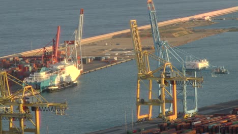 The-Port-of-Barcelona-with-cargo-carrier-cranes-and-containers-at-the-seafront
