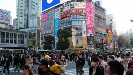 Japanese-tourists-shopping,-road-crossing,-using-transportation-in-Akihabara,-Tokyo,-browsing-the-latest-games-and-exclusive-merchandise-amid-the-vibrant-atmosphere,-store-opening-in-Japan-4K-30fps