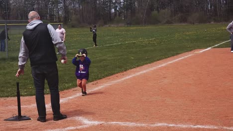 Running-to-first-base-in-t-ball-practise-in-South-Portland,-Maine