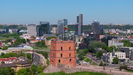 Lithuanian-Flag-at-Gediminas-Tower,-Skyline-View-in-Background