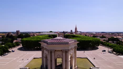 Aerial-revealing-shot-of-school-kids-competing-in-sports-at-Peyrou-Royal-Square