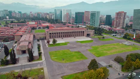 Aerial-Orbit-shot-of-Military-school-Museum-complex-with-Mountain-range-in-Background,-Santiago-de-Chile