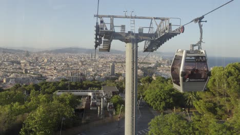 Urban-city-skyline-view-of-Barcelona-going-up-the-cable-lift-to-Montjuic-park