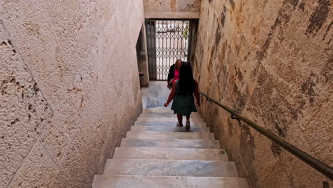 Woman-At-The-Stairs-Of-The-Stoa-of-Attalos-Museum-In-The-Agora-Of-Athens,-Greece