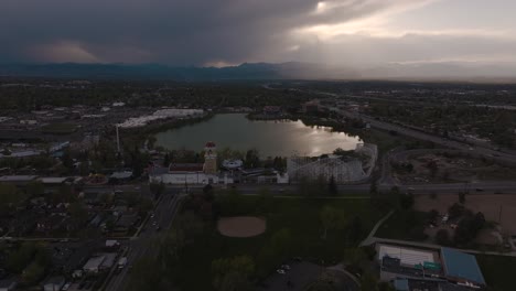 Wide-aerial-footage-of-Lakewood-and-the-mountains-during-sunset
