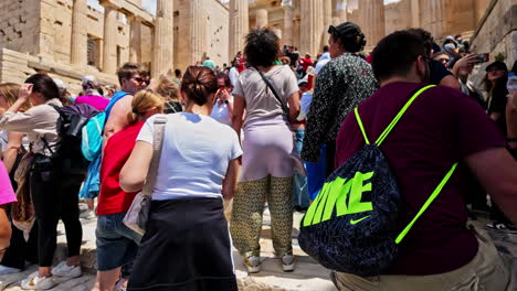 Crowded-tourist-historical-landmark-Monument-of-Agrippa-at-Acropolis-Athens-Greece