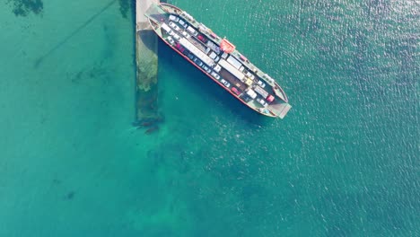 Aerial-Bird-Eye-View-Of-Ferry-Boat-Waiting-At-Big-Island-of-Chiloé,-Chile