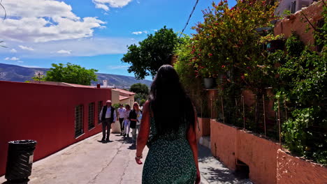 Young-woman-traveller-walking-streets-of-Athens-Greece-neighbourhood-summer-beautiful-weather