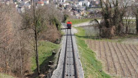 Red-funicular-in-Crans-Montana-going-up-mountain