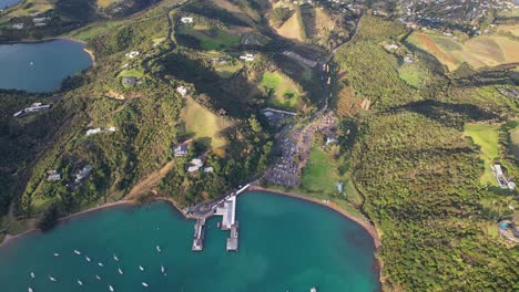 Top-Down-View-Over-Matiatia-Bay-With-Boats-In-Auckland,-New-Zealand---Drone-Shot