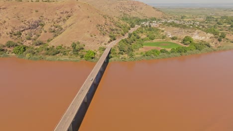 Car-crossing-the-long-bridge-above-Tsiribihina-River-in-Madagascar-countryside