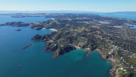 Aerial-View-Over-Beaches-In-Waiheke-Island,-Auckland,-New-Zealand---Drone-Shot