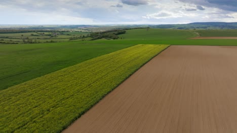 land-that-has-just-been-turned-over,-landscape-drone-shot-with-fields