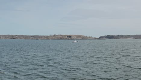 Boat-travelling-across-the-choppy-waters-of-the-Atlantic-Ocean-during-a-beautiful-spring-day