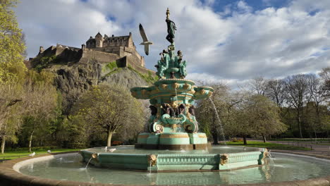 Slowmotion-seagull-flying-around-the-Ross-Fountain-in-Edinburgh-on-a-sunny-day