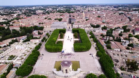 Aerial-establishing-shot-of-downtown-Montpellier-with-a-crowd-of-children