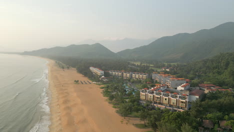 High-Angle-Drone-Of-Chan-May-Bay-And-Beach-With-Luxury-Vietnam-Hotel-In-Lang-Co