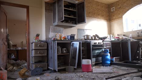 Interiors-of-vandalized-and-abandoned-house-kitchen-of-a-Palestinian-family-after-being-bombed-during-the-Israel-Hamas-war-conflict,-Gaza