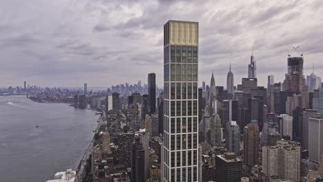 NYC-New-York-Aerial-v327-fly-around-Sutton-Tower,-capturing-panoramic-views-of-East-River,-Roosevelt-Island,-cityscape-of-Midtown-Manhattan-and-Lenox-Hill---Shot-with-Mavic-3-Pro-Cine---September-2023