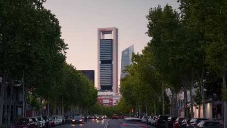 day-to-night-Timelapse-of-modern-futuristic-skyscraper-in-Madrid-Torre-Cepsa-5-Towers-business-area-during-sunset