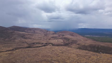 Cairngorms-landscape,-raining-cloud-in-background,-Scotland