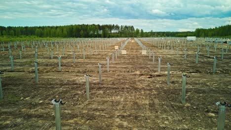 Preparing-a-farmland-field-to-install-a-solar-panel-farm---pullback-aerial-hyper-lapse-reveal