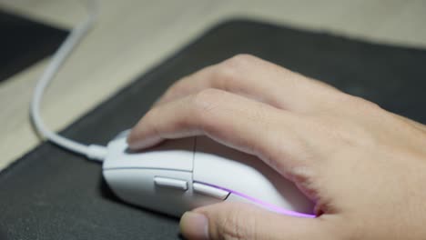 Hand-Gestures-Of-Wired-Computer-Mouse-User,-Device-Movement-On-Desk-Mousepad
