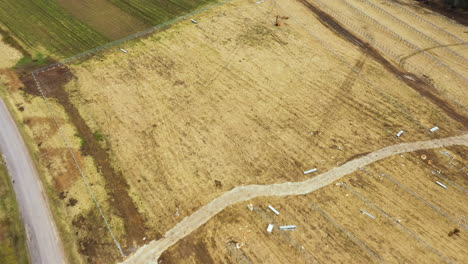 Land-preparation-process-for-solar-panel-farm-in-countryside-area,-aerial-view