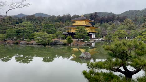 Reflections-of-the-Kinkaku-ji-temple-in-a-pond-near-Kyoto,-Japan