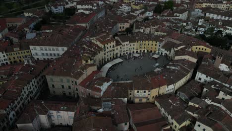 Lucca-Italy-busy-downtown-city-centre-pullback-flight