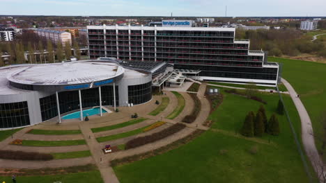 Aerial-Dolly-out-View-of-Tervise-Paradiis-Hotel-and-Water-Park-in-Pärnu-on-a-Cloudy-Day