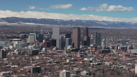 City-Wash-Park-Downtown-Denver-Colorado-aerial-drone-neighborhood-streets-Spring-Mount-Blue-Sky-Evans-Front-Range-Rocky-Mountains-foothills-skyscrapers-daytime-sunny-clouds-slow-zoom-in