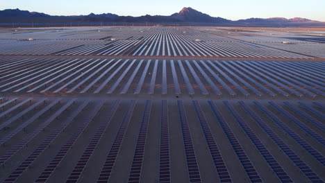 Solar-Power-Plant,-Aerial-View-of-Massive-Array-of-Solar-Panels-in-Desert-Landscape,-Drone-Shot