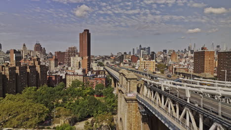 NYC-New-York-Aerial-v407-low-flyover-community-park-in-Two-Bridges-along-Manhattan-bridge-capturing-traffic-on-the-roadway-and-Chinatown-cityscape-view---Shot-with-Mavic-3-Pro-Cine---September-2023