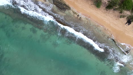 Aerial-View-Down-onto-Waves-on-Kauai,-HI-Beach
