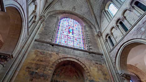 Stained-glass-windows-interior-and-vaulted-ceiling-of-Saint-Julian-Gothic-Cathedral,-Le-Mans-in-France