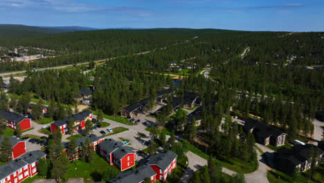Aerial-flyover-cottages-and-houses-in-the-Saariselka-village,-summer-in-Finland